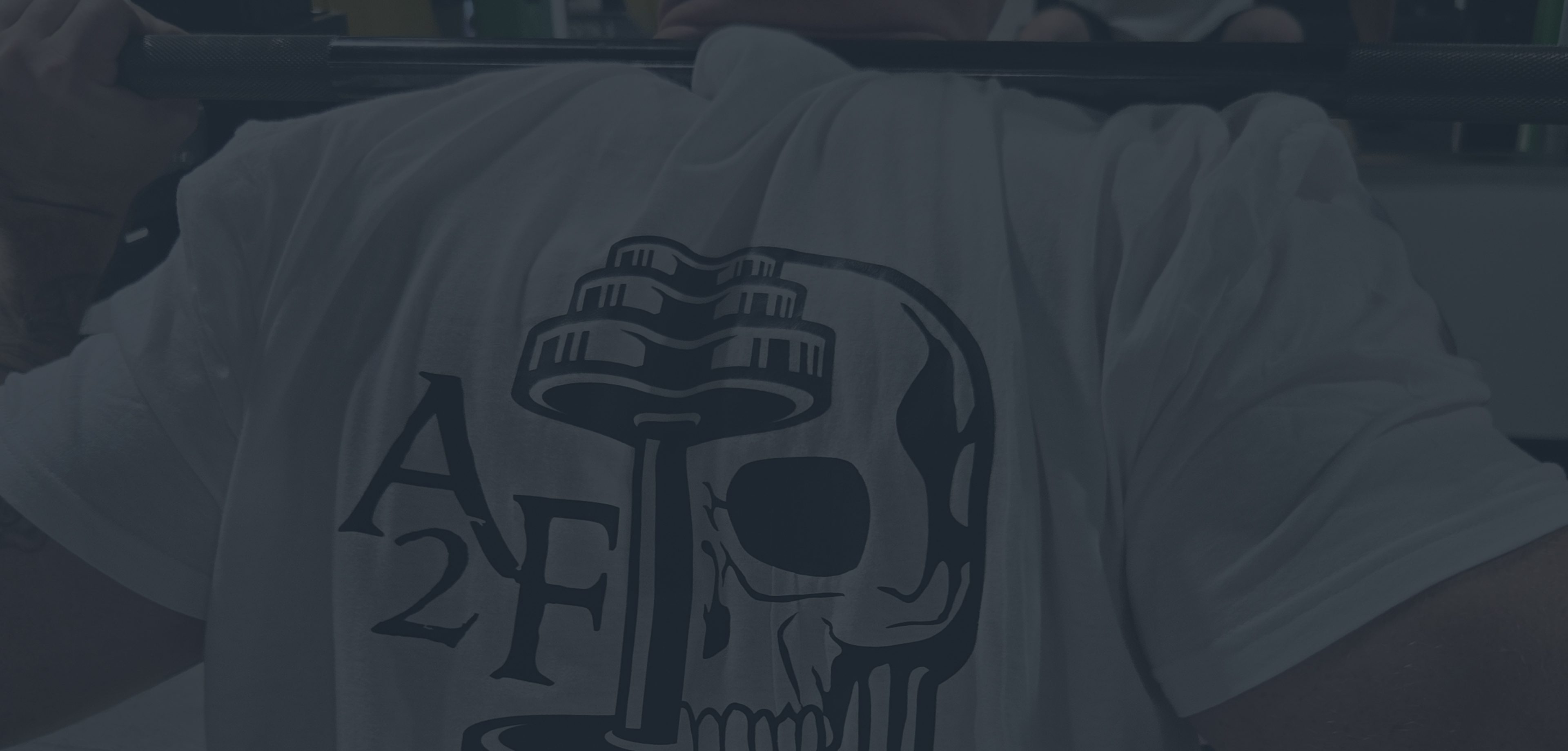 T-shirt with a skull and building design in black and white.